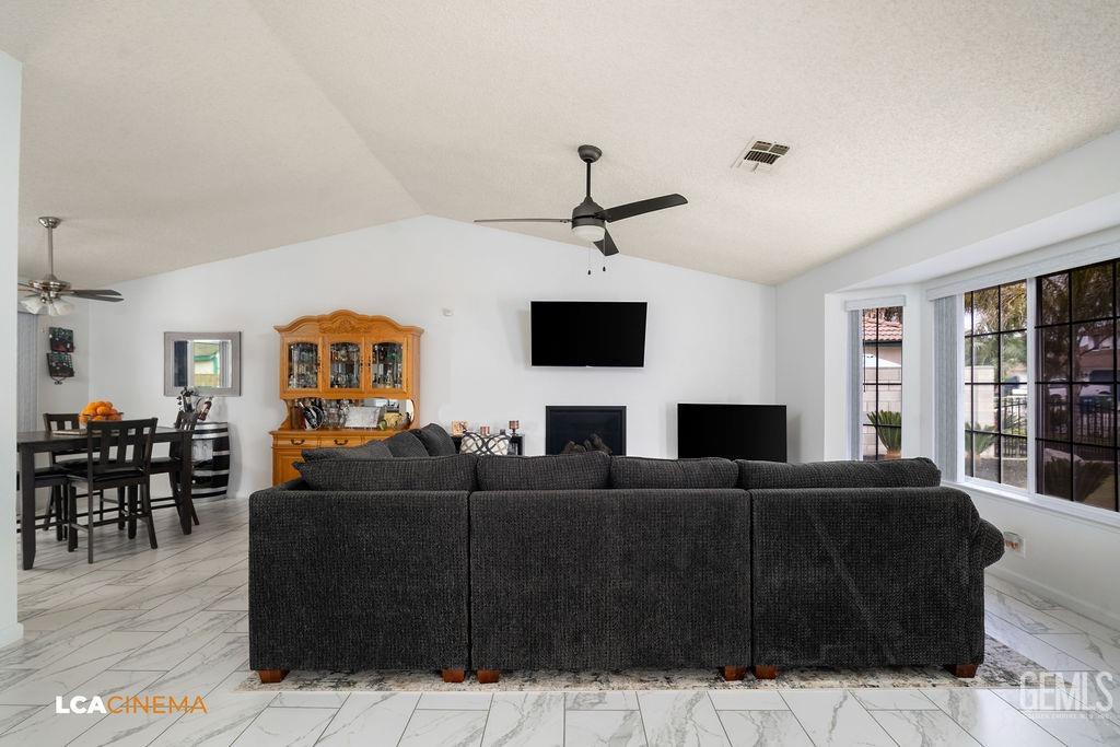 Undisclosed Address Delano, CA 93215 - Photo 14 of 35 a living room with furniture a flat screen tv and a window