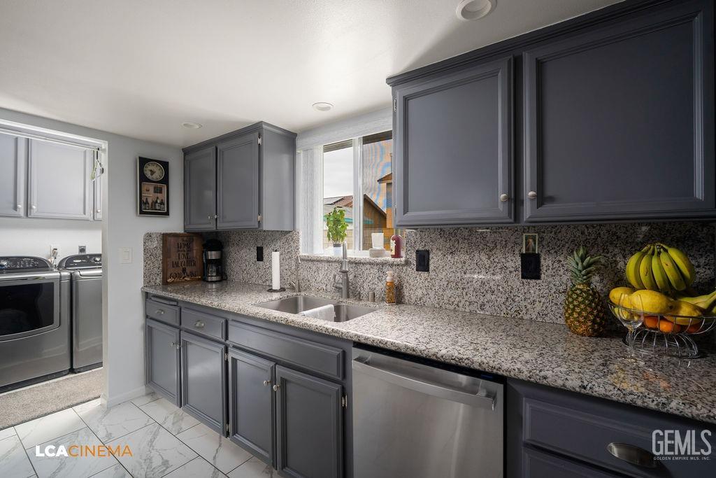 Undisclosed Address Delano, CA 93215 - Photo 19 of 35 a kitchen with stainless steel appliances granite countertop a sink a stove and cabinets