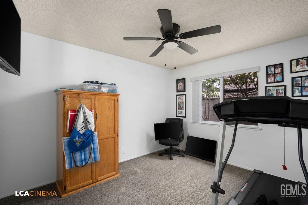 Undisclosed Address Delano, CA 93215 - Photo 23 of 35 a living room with furniture and a flat screen tv