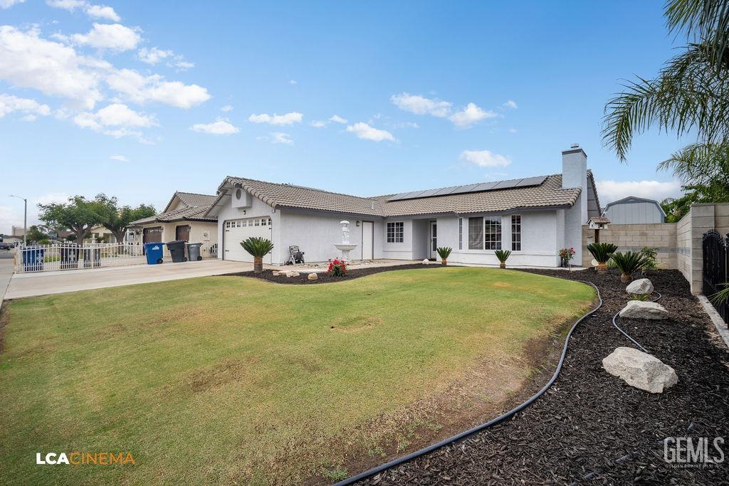 Undisclosed Address Delano, CA 93215 - Photo 4 of 35 a front view of the house with yard