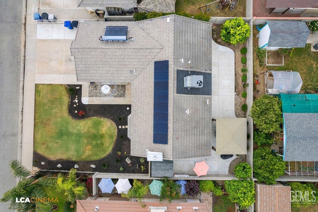 Undisclosed Address Delano, CA 93215 - Photo 10 of 35 an aerial view of a house with a swimming pool