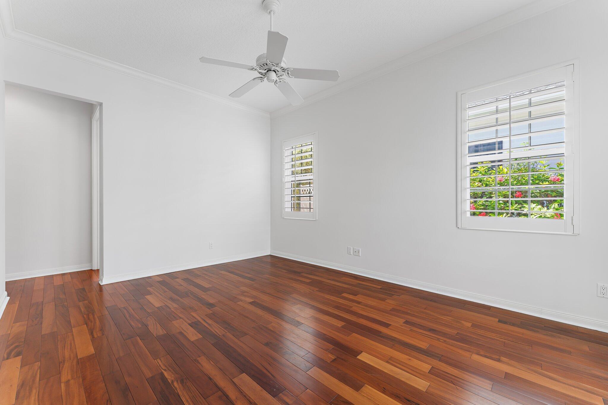 215 New Haven Boulevard Jupiter, FL 33458 - Photo 26 of 42 a view of an empty room with wooden floor and a window