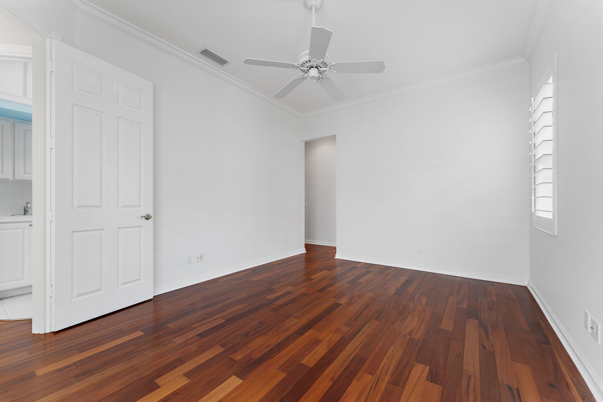 215 New Haven Boulevard Jupiter, FL 33458 - Photo 27 of 42 a view of an empty room with wooden floor