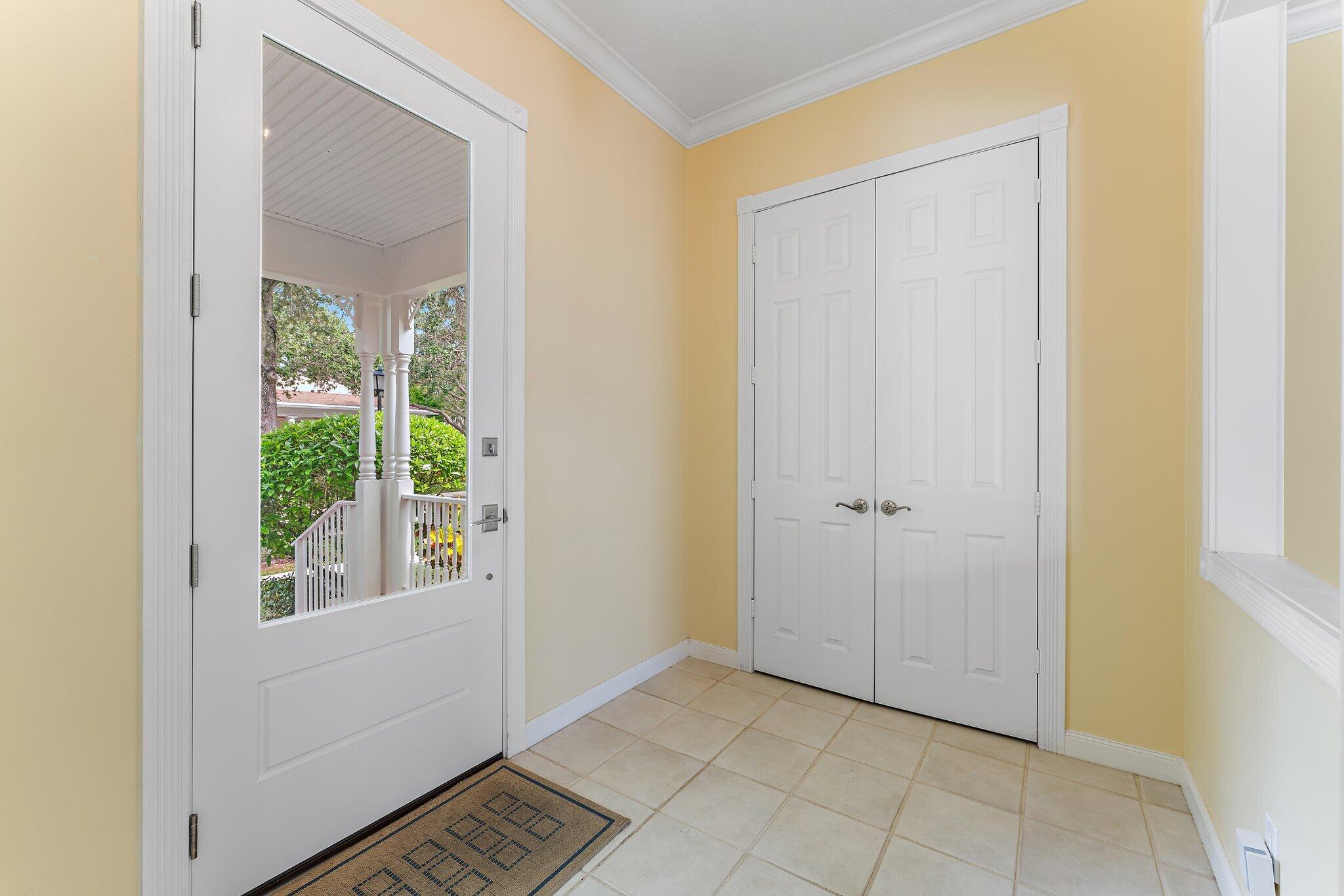 215 New Haven Boulevard Jupiter, FL 33458 - Photo 4 of 42 a view of an entryway with wooden floor