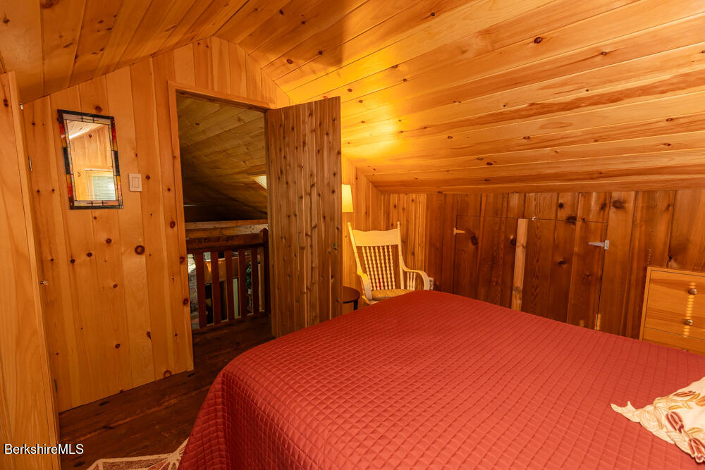 3 Indian Road Stockbridge, MA 01262 - Photo 17 of 23 a bedroom with a bed and a table