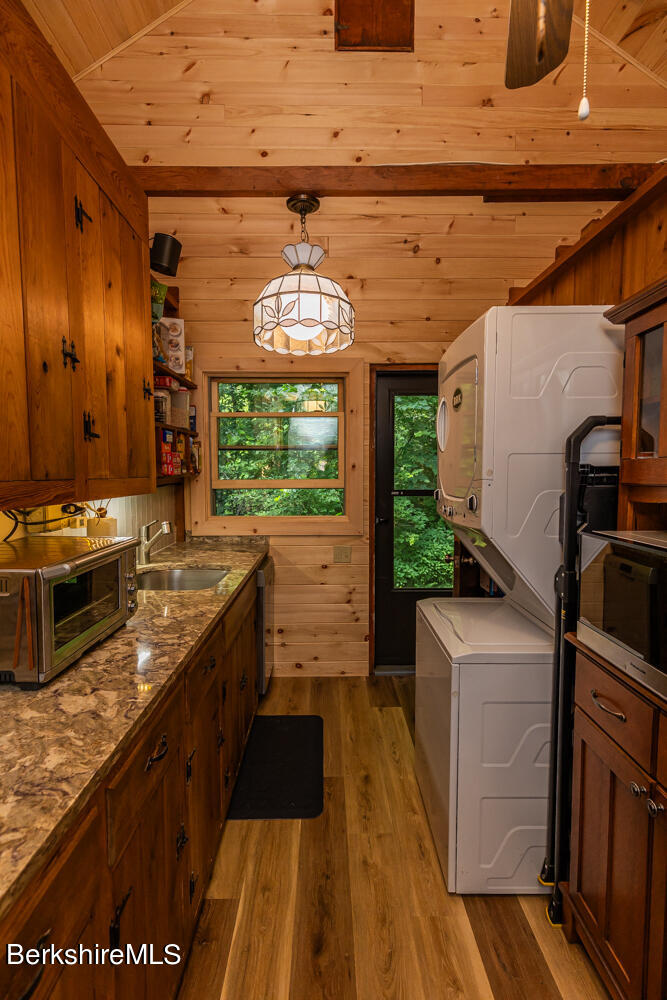 3 Indian Road Stockbridge, MA 01262 - Photo 10 of 23 a kitchen with stainless steel appliances granite countertop a stove a sink and a microwave