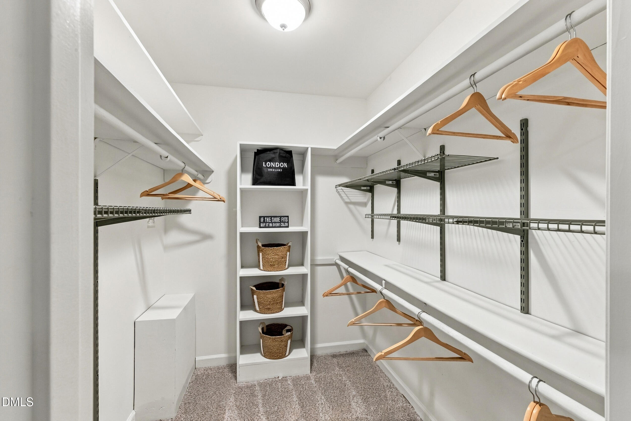 2329 Win Road Garner, NC 27529 - Photo 52 of 90 Walk-in closet with carpet flooring, built-in shelving, and hanging rods