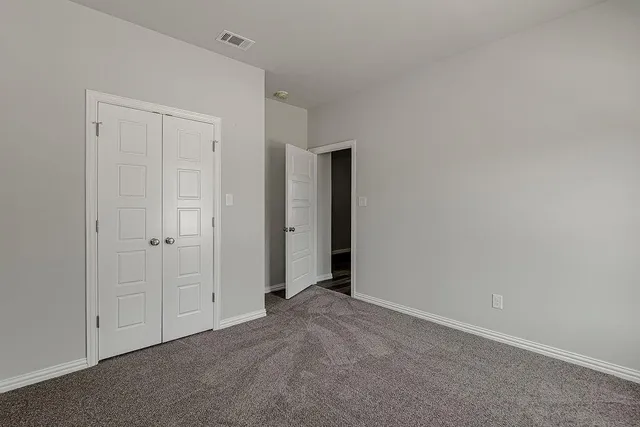 a bathroom with a granite countertop sink a toilet and bathtub