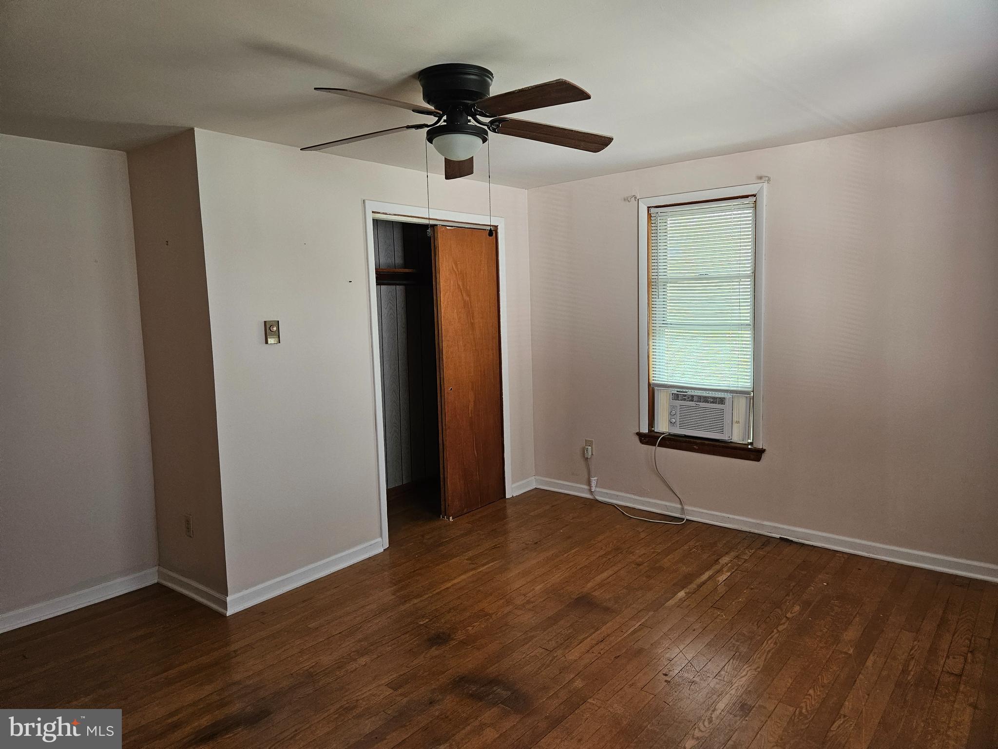 449 Harmison Place Romney, WV 26757 - Photo 31 of 74 a view of an empty room with a window and wooden floor