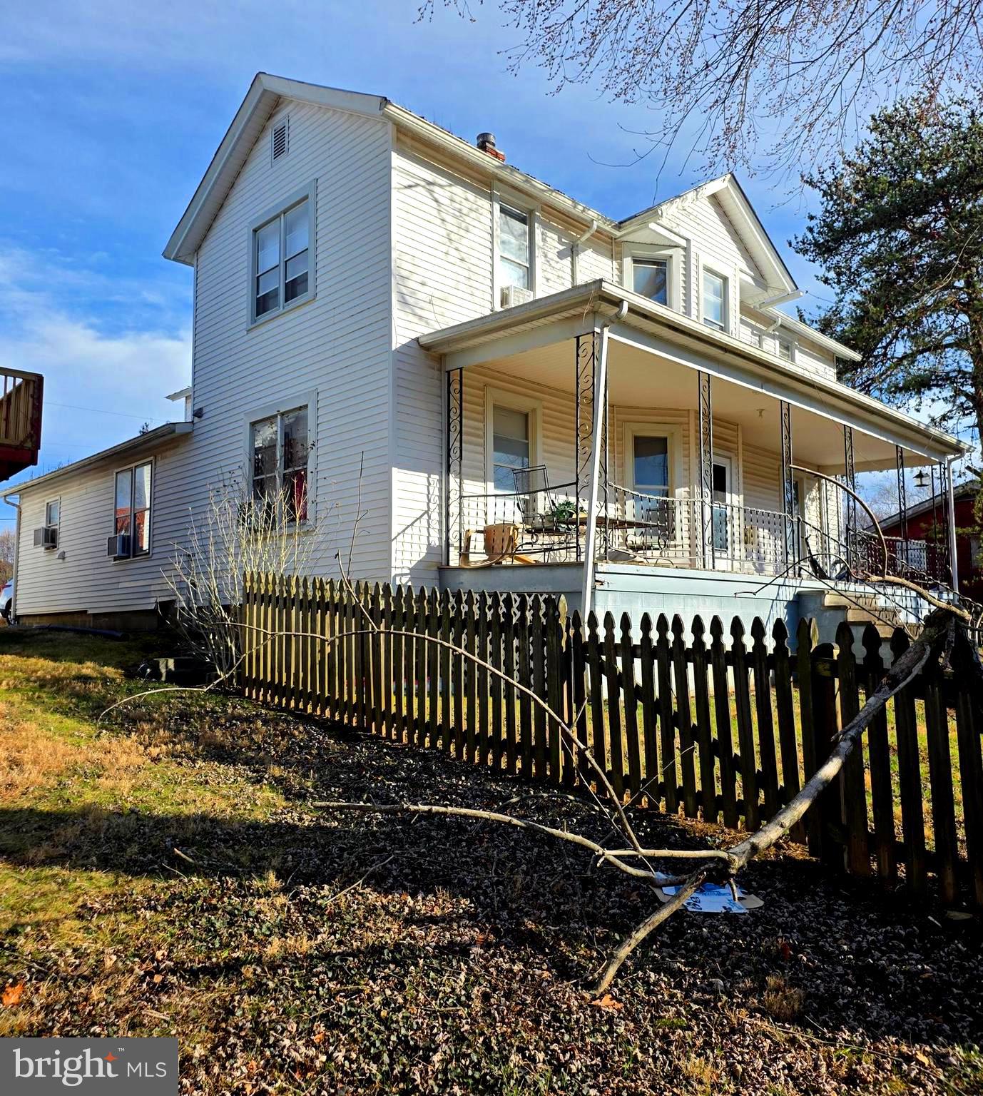449 Harmison Place Romney, WV 26757 - Photo 4 of 74 a front view of a house with a yard