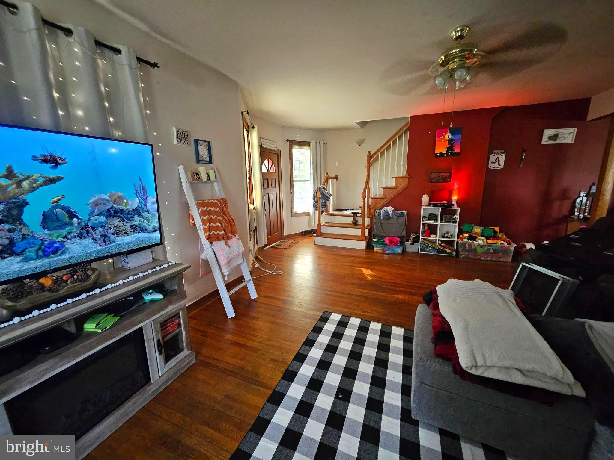449 Harmison Place Romney, WV 26757 - Photo 43 of 74 a living room with furniture a rug and a flat screen tv