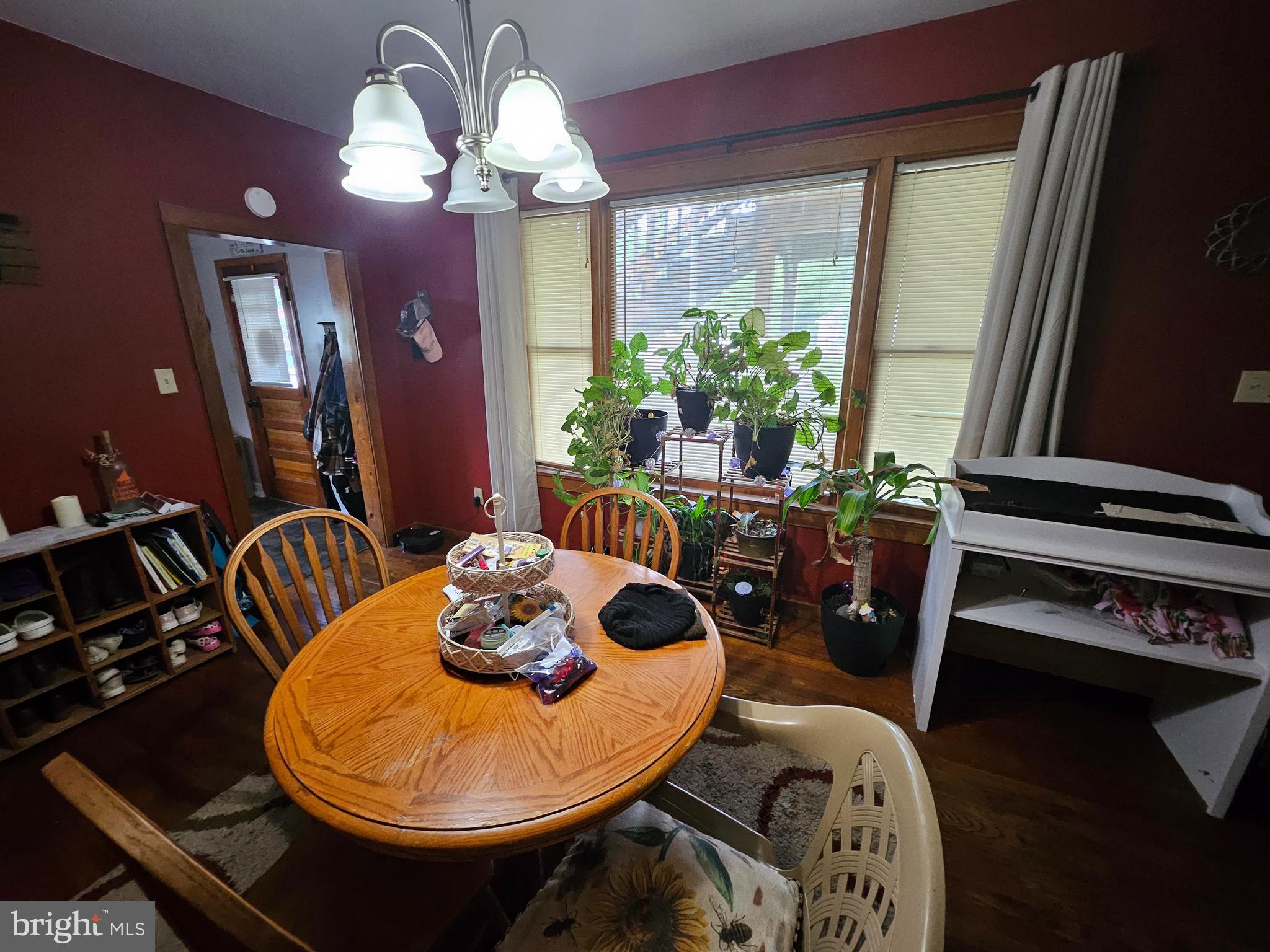 449 Harmison Place Romney, WV 26757 - Photo 52 of 74 a view of a dining room with furniture and wooden floor