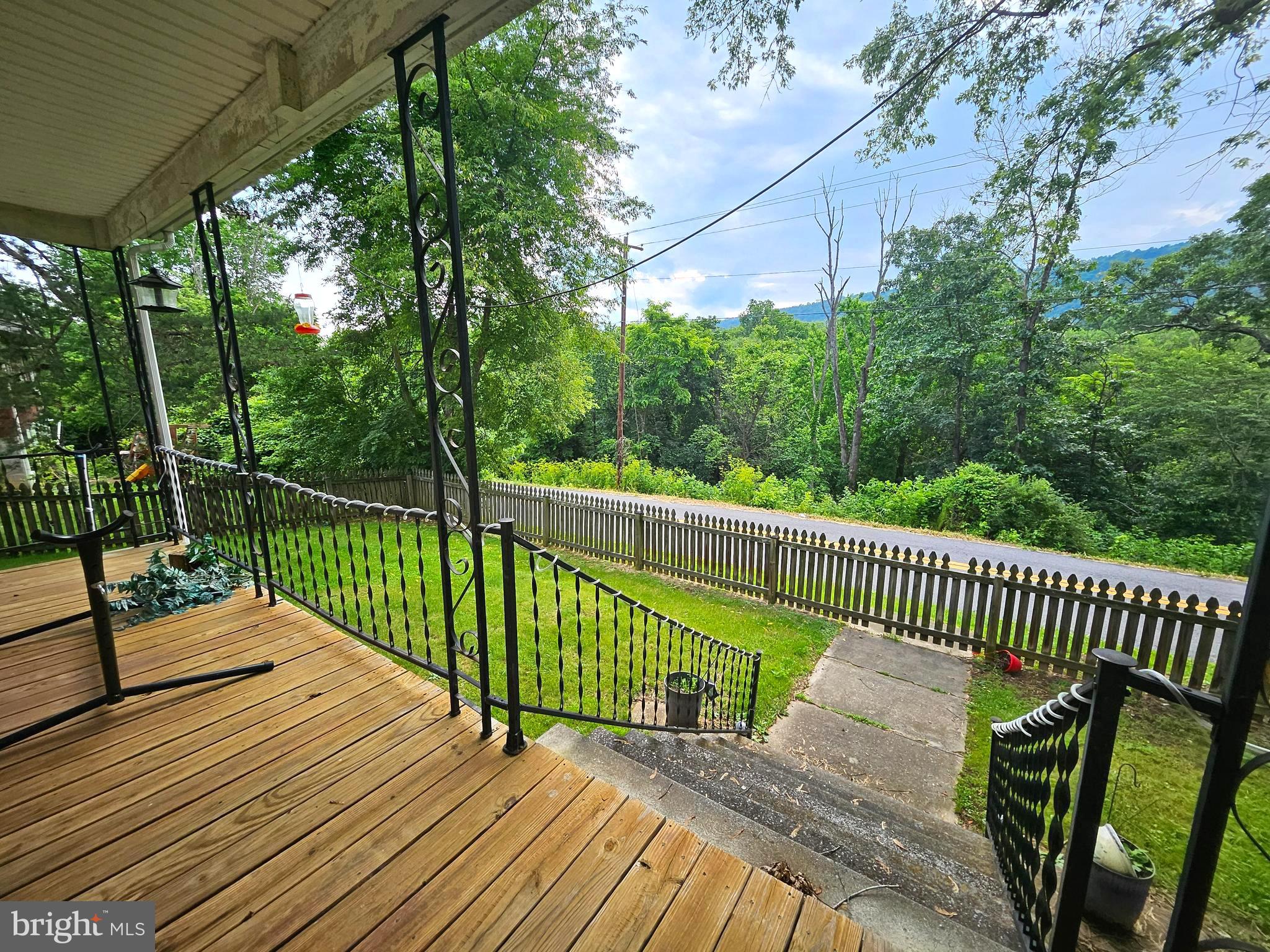 449 Harmison Place Romney, WV 26757 - Photo 62 of 74 a view of a wooden deck with a bench