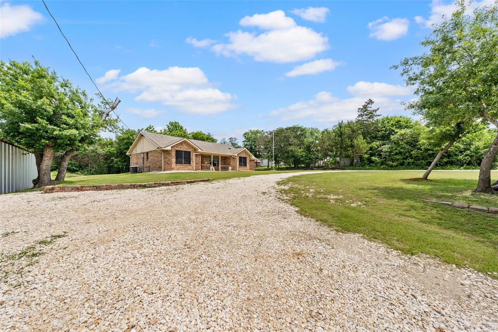 162 High Ridge Drive Bruceville, TX 76630 - Photo 6 of 40 a front view of a house with a yard