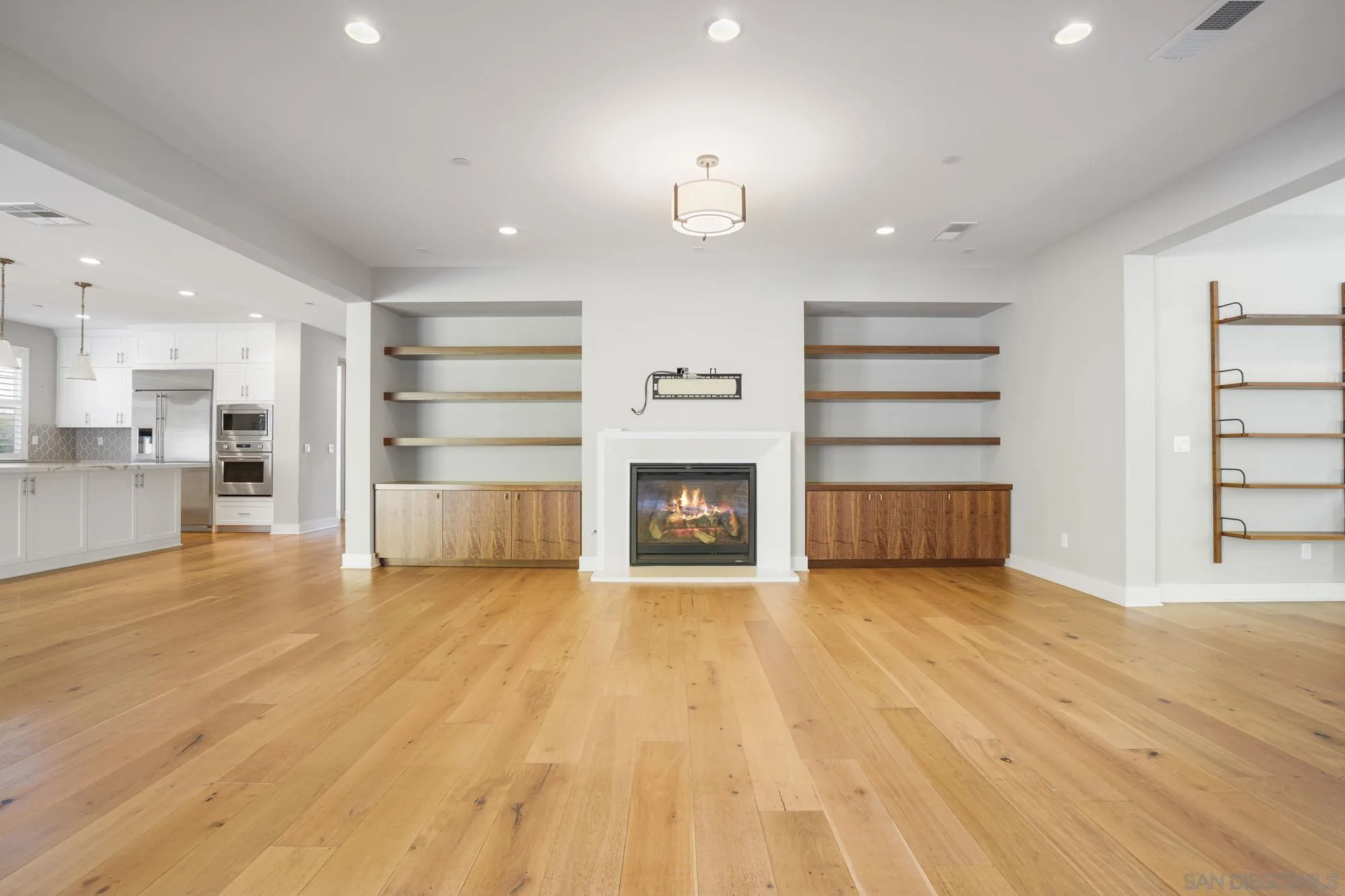 833 Channel Island Drive Encinitas, CA 92024 - Photo 14 of 38 a view of a room with a fireplace cabinet and windows