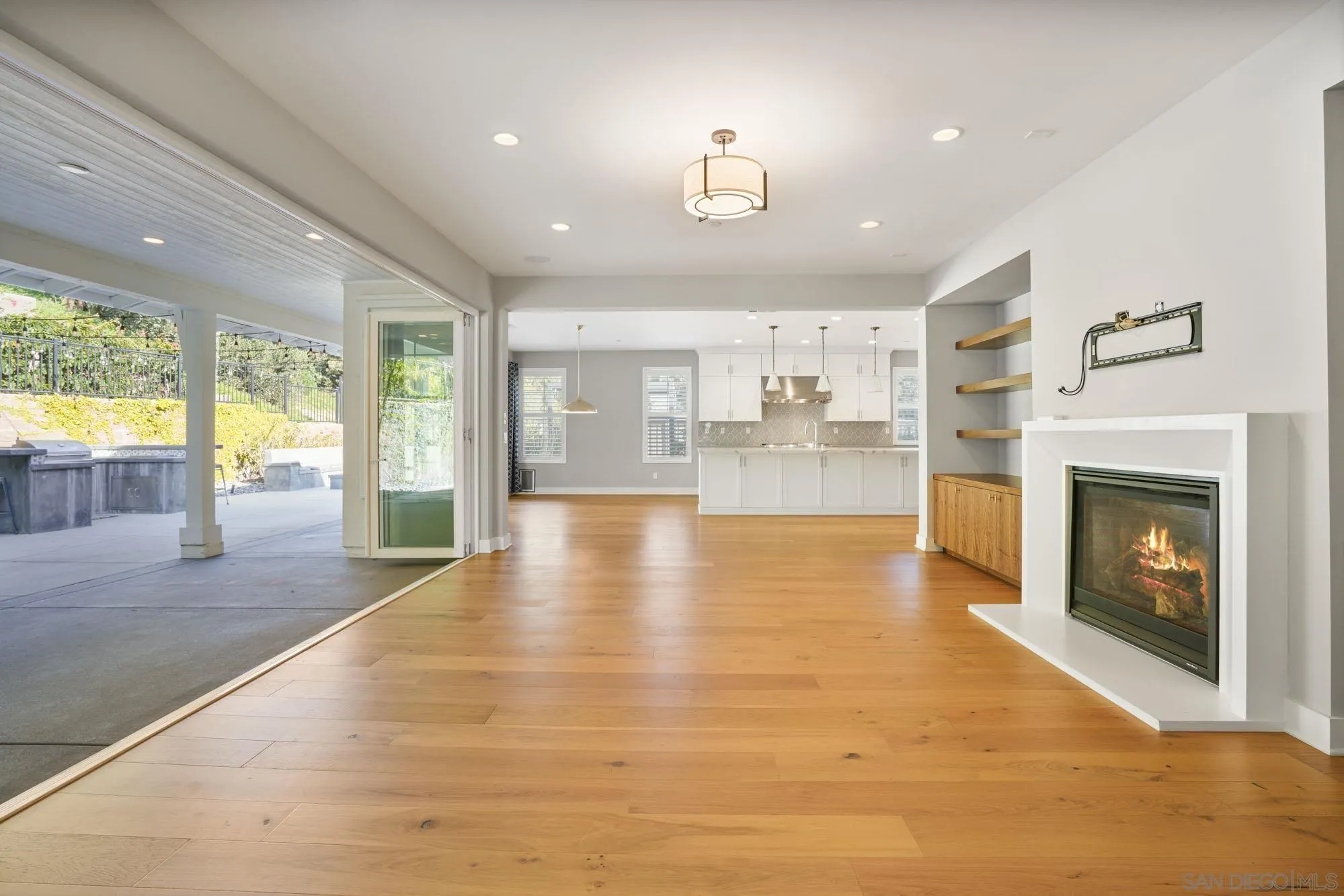 833 Channel Island Drive Encinitas, CA 92024 - Photo 16 of 38 a view of a living room a large window and kitchen view