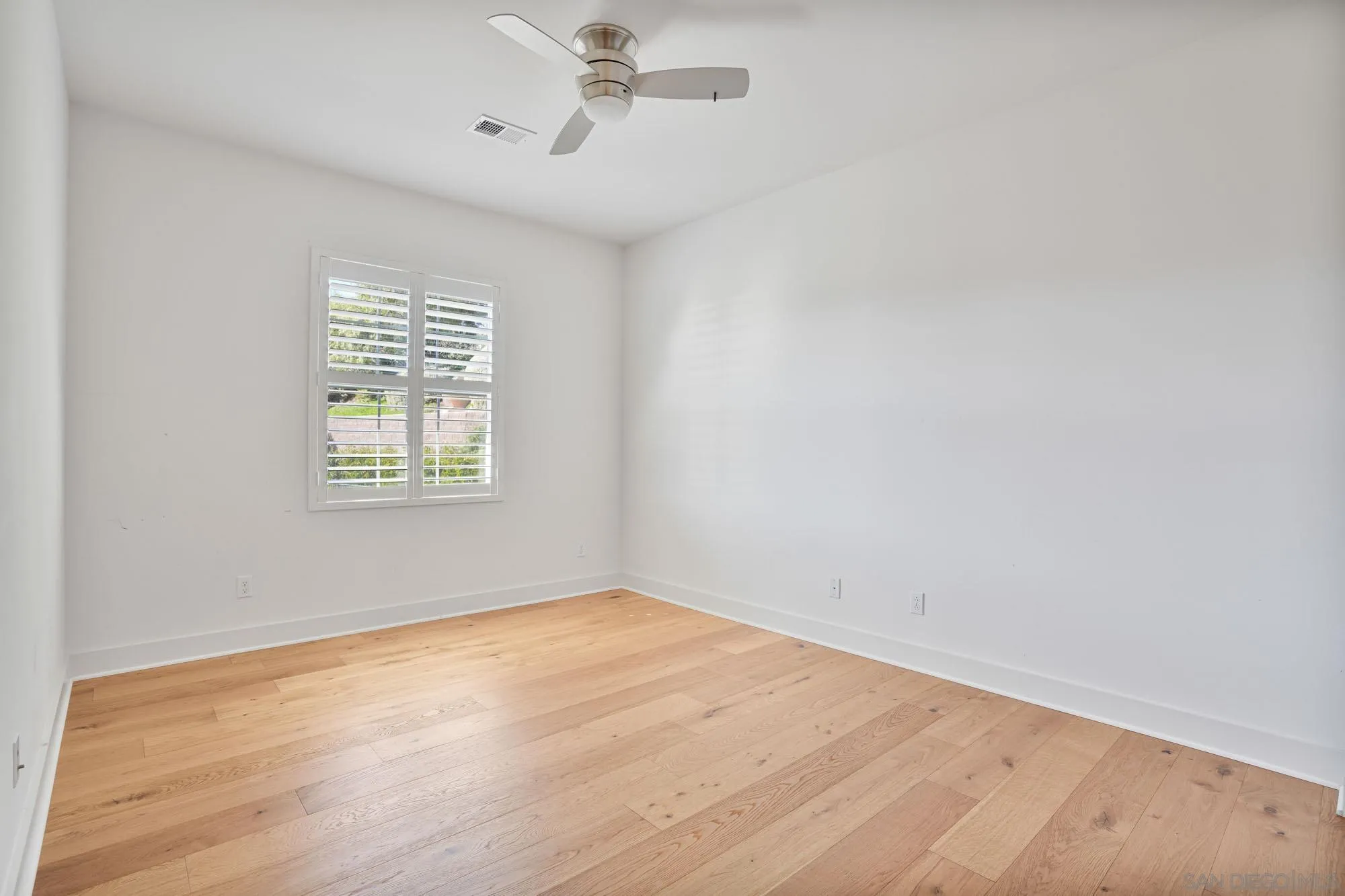 833 Channel Island Drive Encinitas, CA 92024 - Photo 23 of 38 wooden floor in an empty room with a window