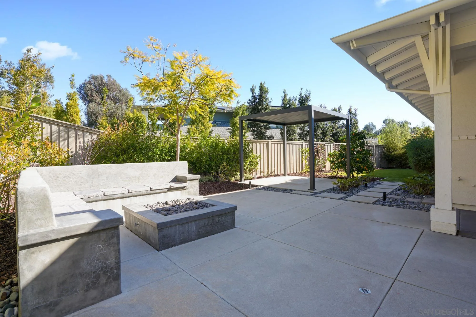 833 Channel Island Drive Encinitas, CA 92024 - Photo 25 of 38 a view of a patio with couches and chairs under an roof