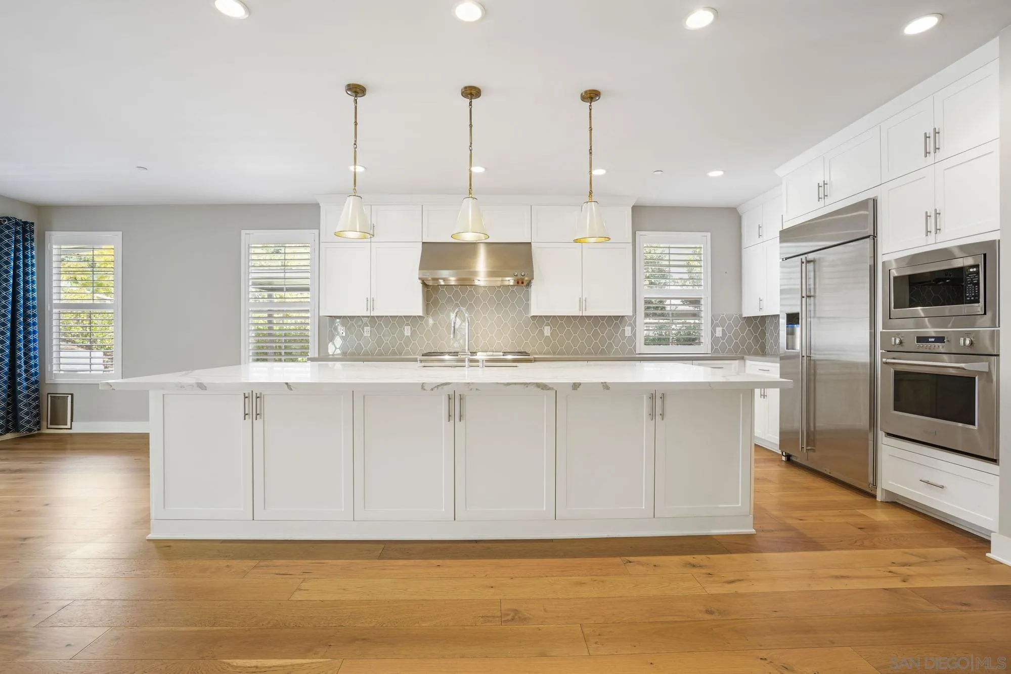 833 Channel Island Drive Encinitas, CA 92024 - Photo 8 of 38 a large kitchen with stainless steel appliances granite countertop a granite counter tops and a window