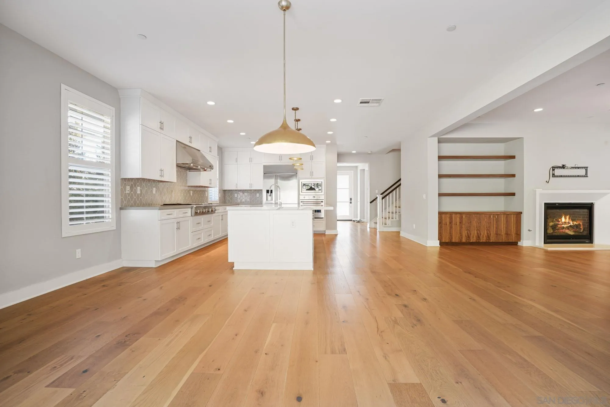 833 Channel Island Drive Encinitas, CA 92024 - Photo 9 of 38 a view of a kitchen with cabinets stainless steel appliances and wooden floor