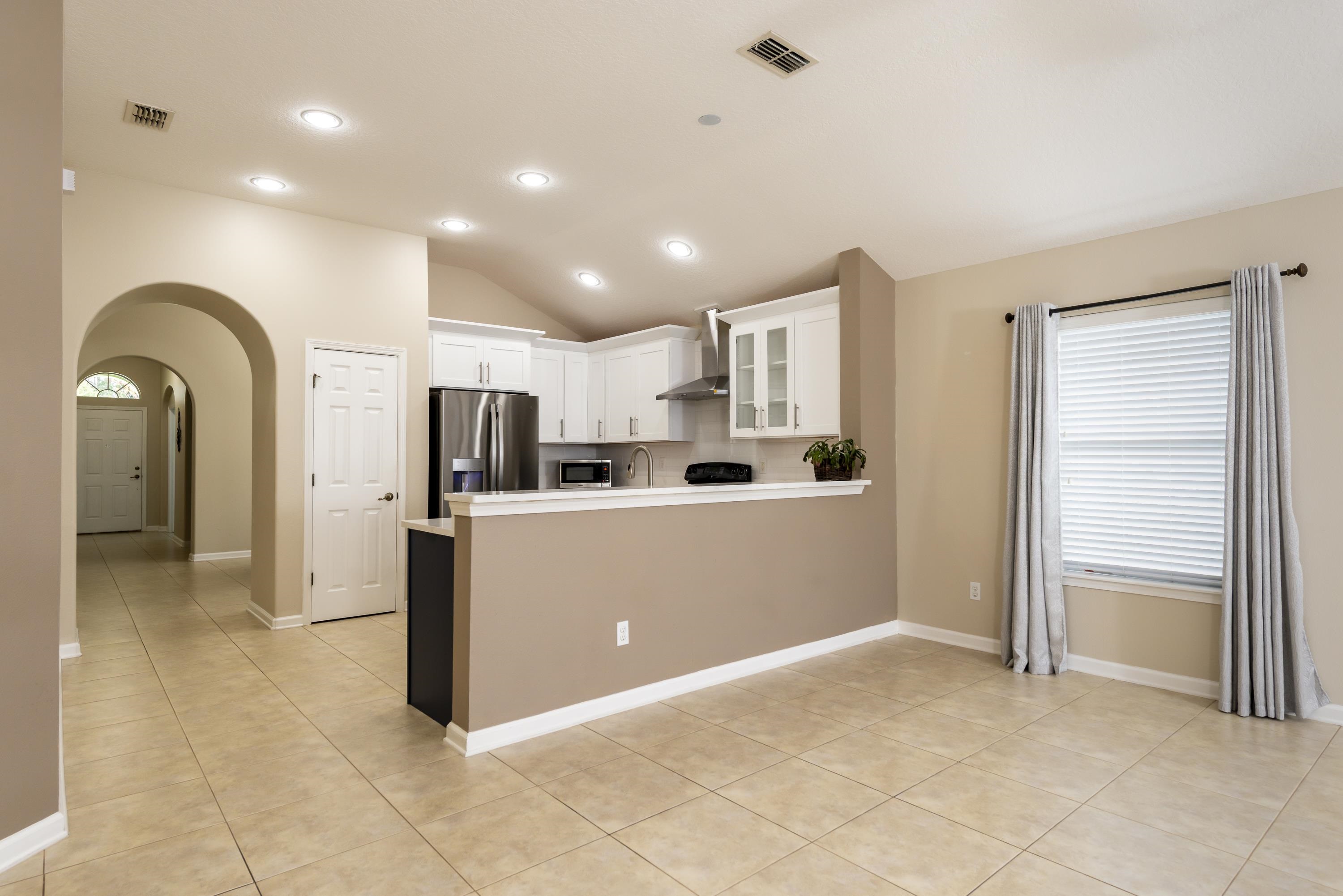 73 Durango Drive St. Augustine, FL 32086 - Photo 14 of 38 a view of kitchen with stainless steel appliances granite countertop a refrigerator and a sink