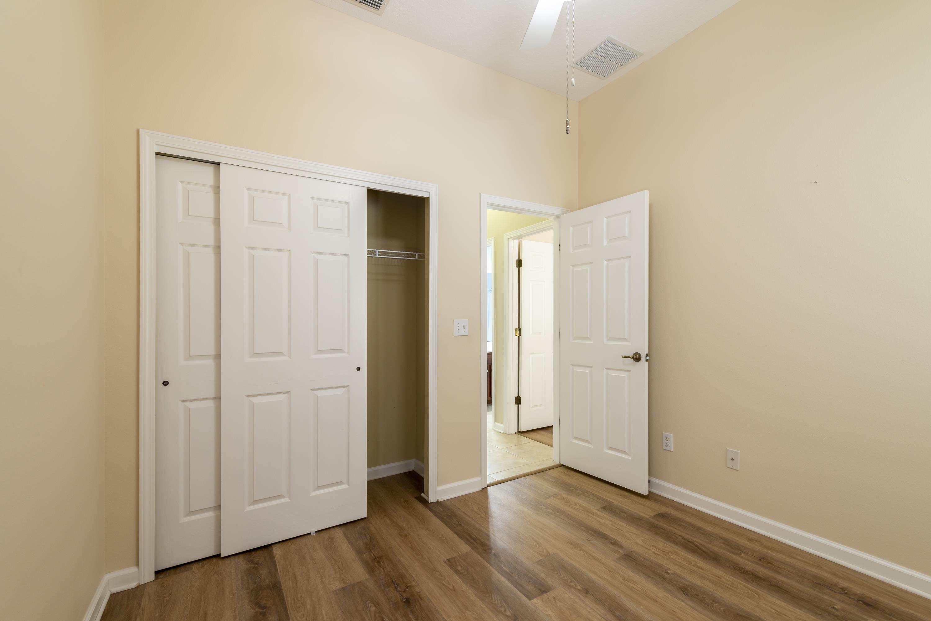 73 Durango Drive St. Augustine, FL 32086 - Photo 19 of 38 a view of an empty room and wooden floor