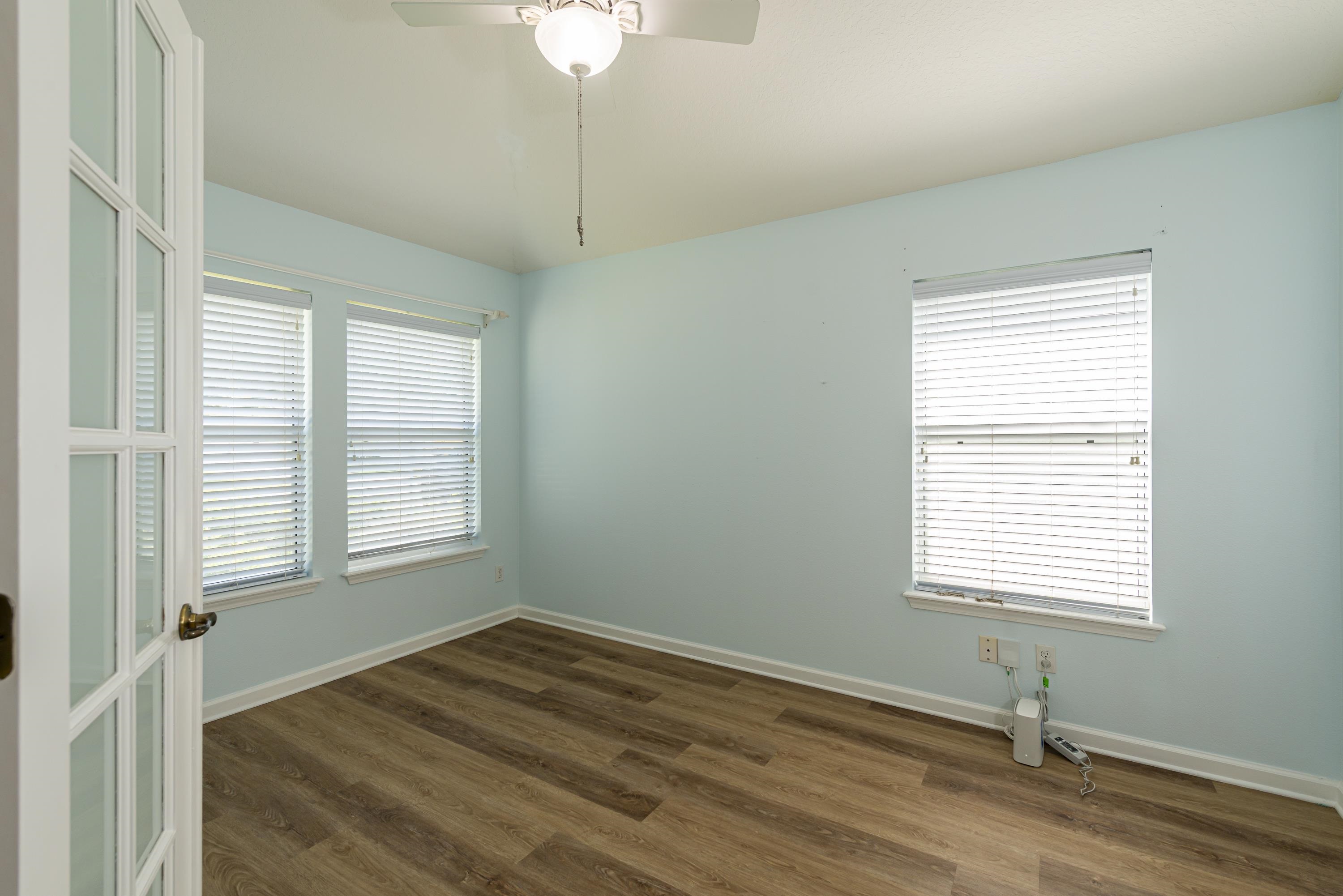 73 Durango Drive St. Augustine, FL 32086 - Photo 2 of 38 a view of an empty room with wooden floor and a window