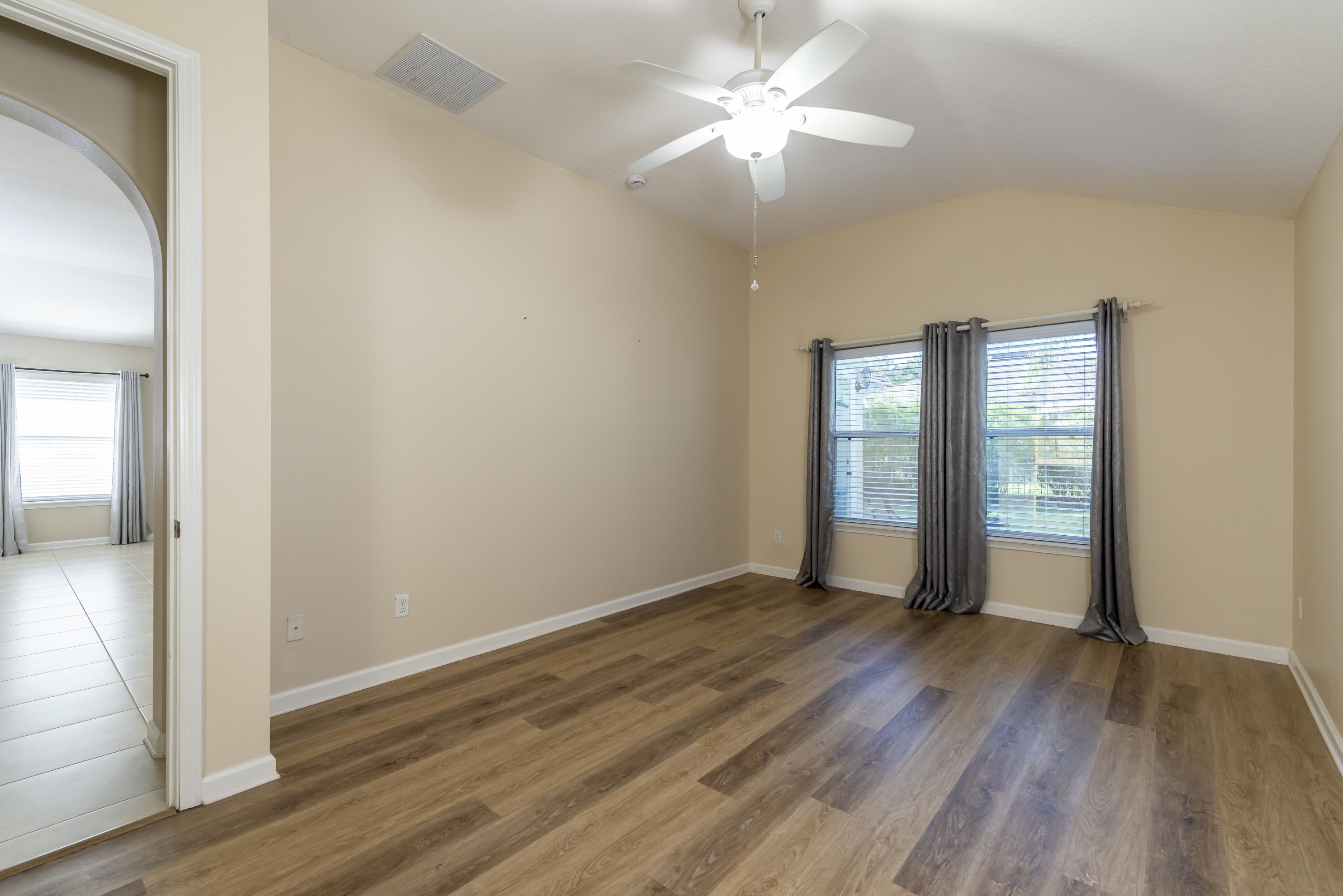 73 Durango Drive St. Augustine, FL 32086 - Photo 21 of 38 wooden floor in an empty room with a window