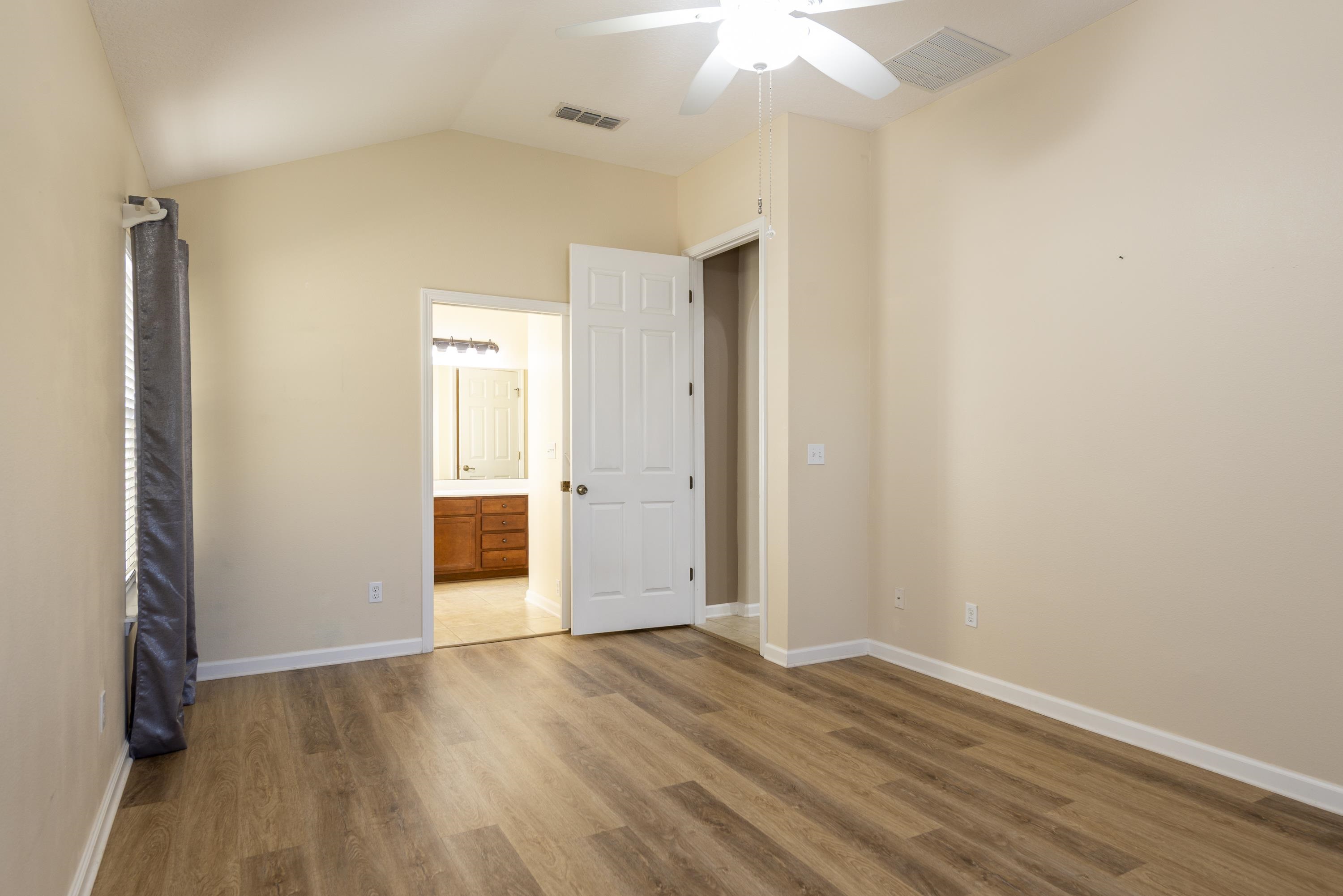 73 Durango Drive St. Augustine, FL 32086 - Photo 22 of 38 an empty room with wooden floor and a ceiling fan
