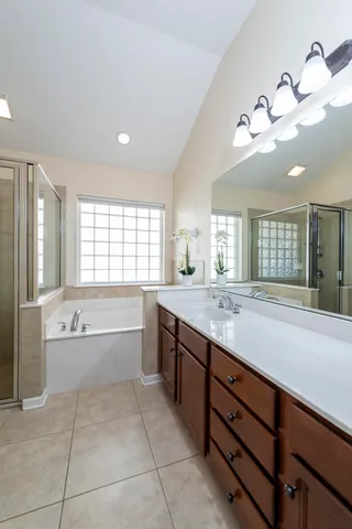 a bathroom with a bathtub and a shower