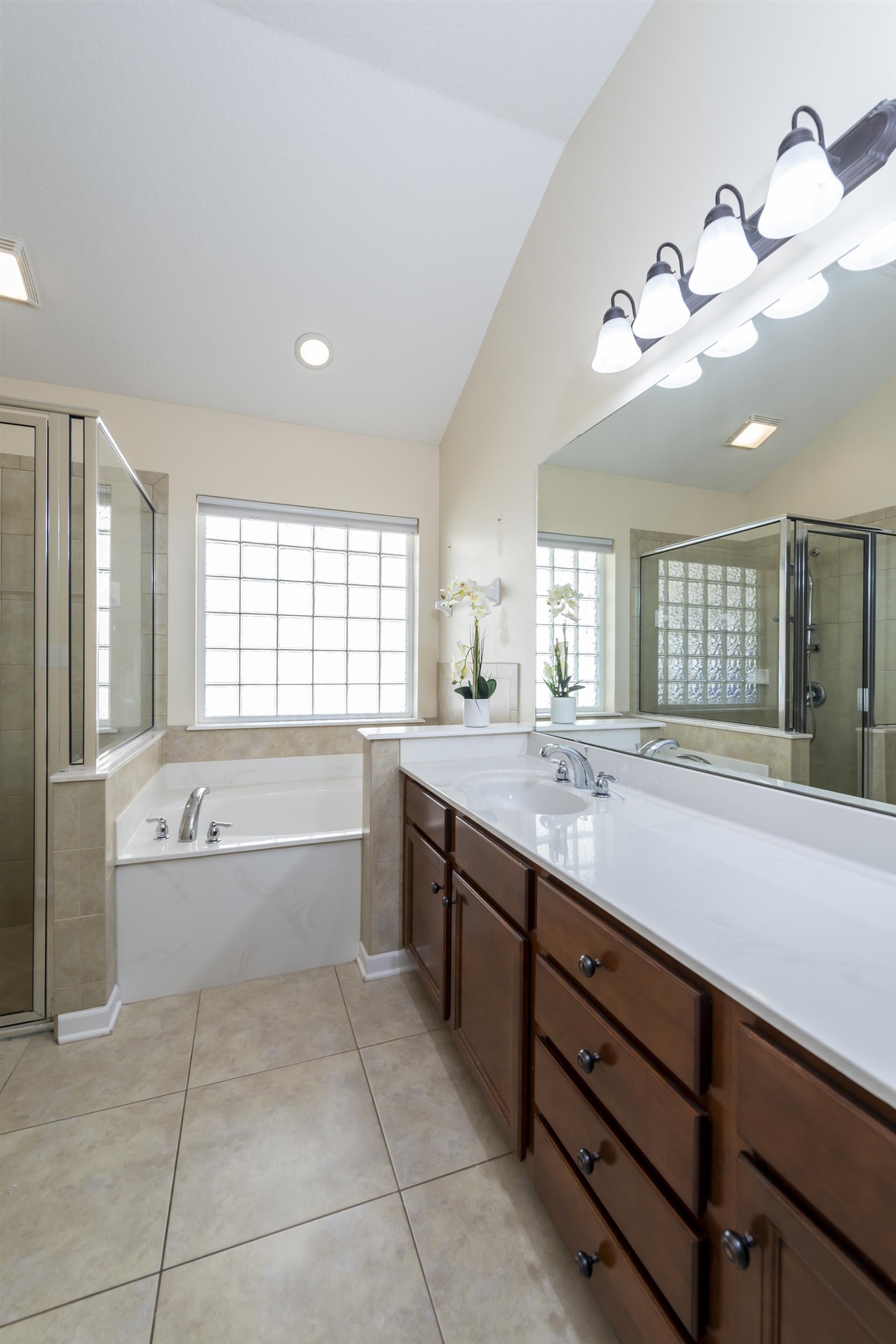 73 Durango Drive St. Augustine, FL 32086 - Photo 23 of 38 a large spacious bathroom with a granite countertop tub sitting next to a large window