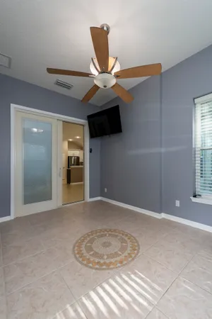 a view of a livingroom with furniture and a window