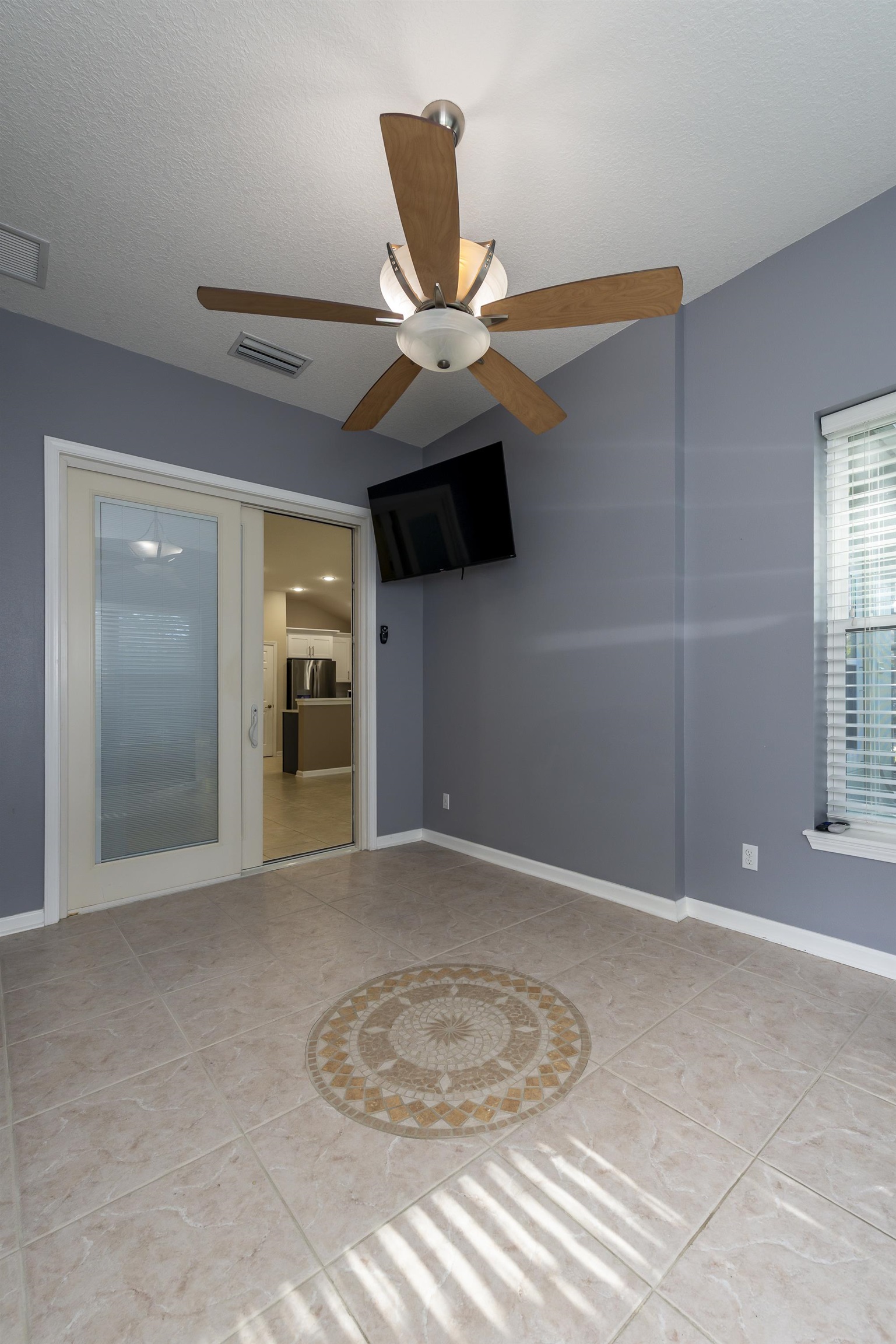 73 Durango Drive St. Augustine, FL 32086 - Photo 27 of 38 a view of a livingroom with a ceiling fan and window