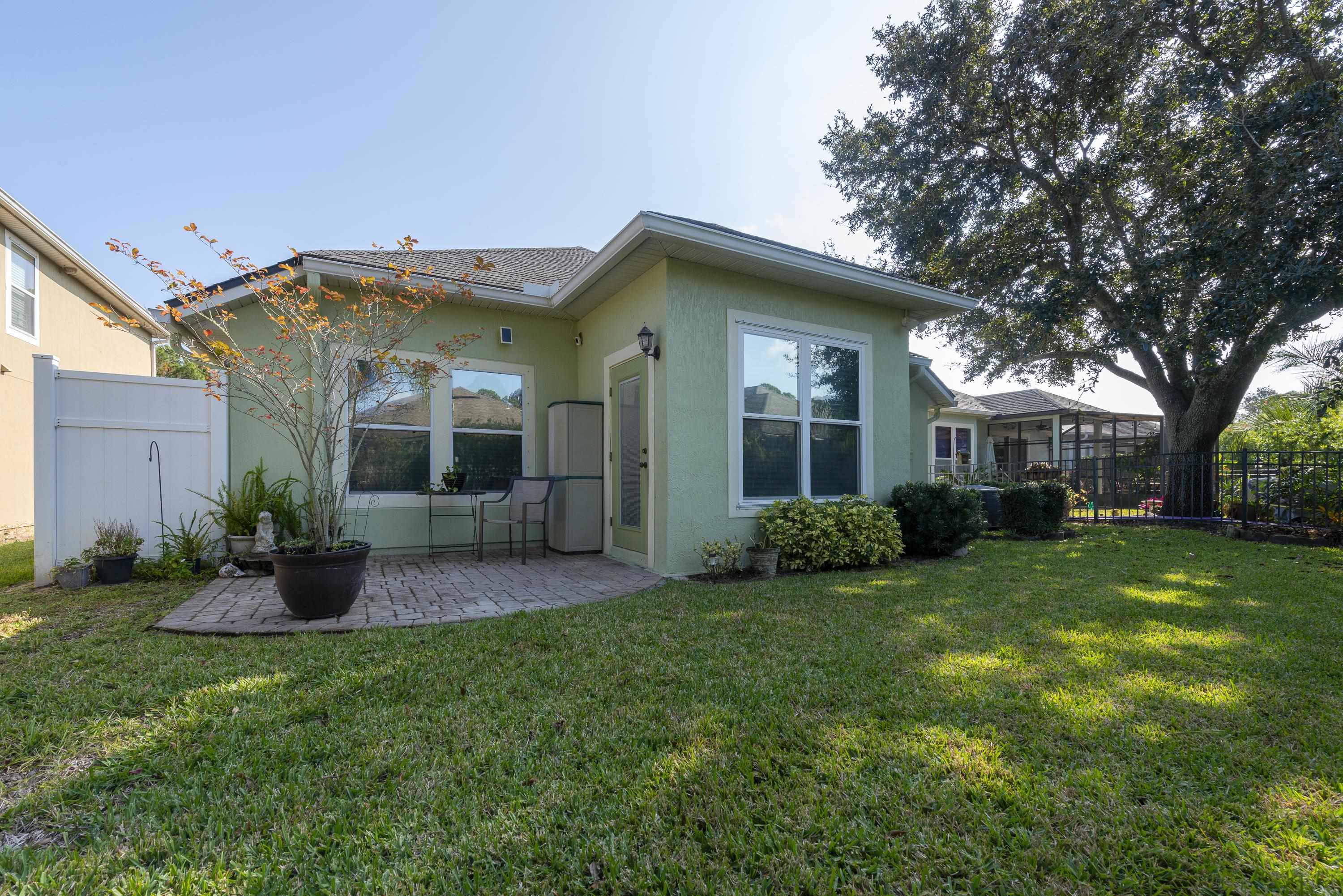 73 Durango Drive St. Augustine, FL 32086 - Photo 30 of 38 a view of a house with a yard and plants