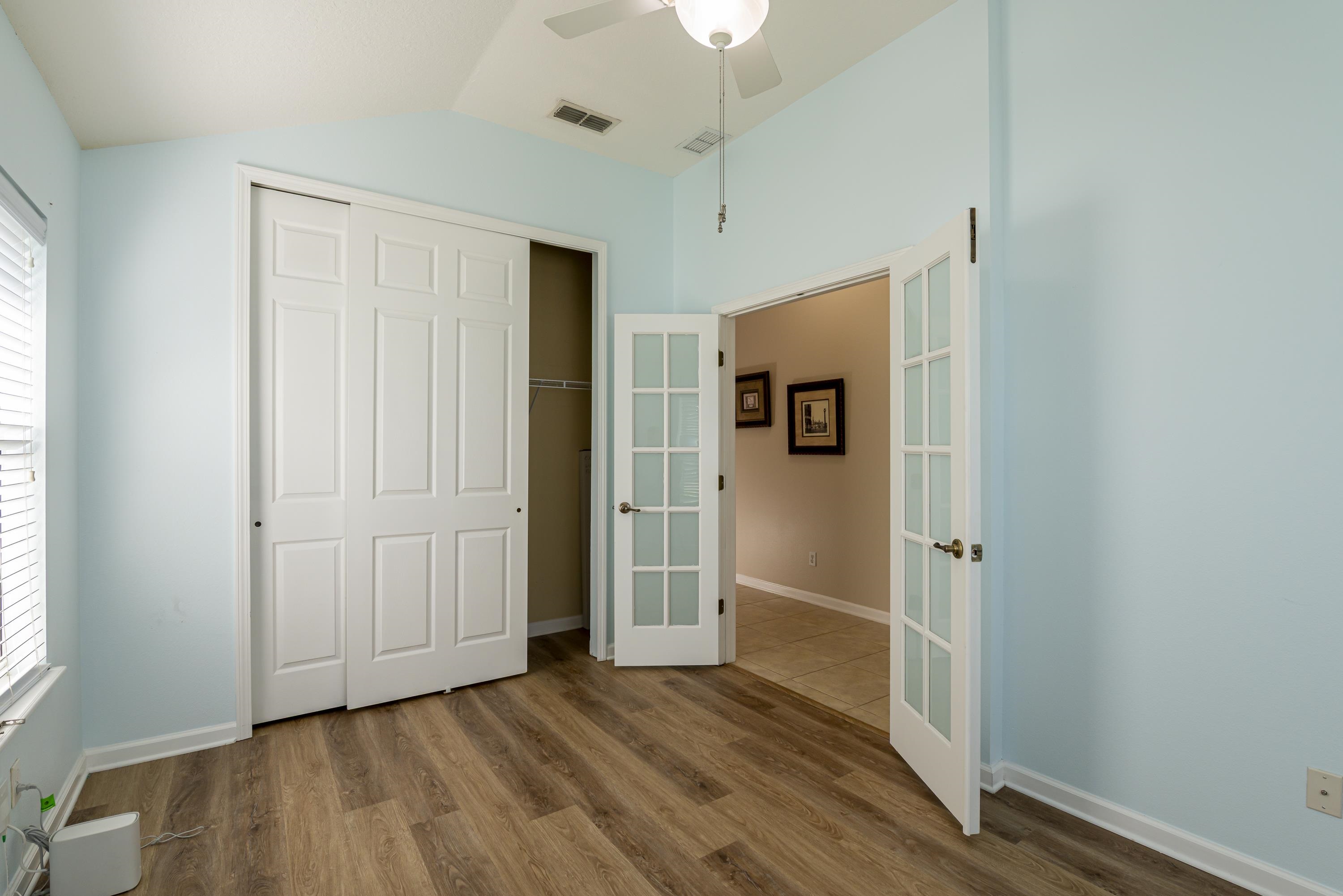 73 Durango Drive St. Augustine, FL 32086 - Photo 3 of 38 an empty room with wooden floor and windows