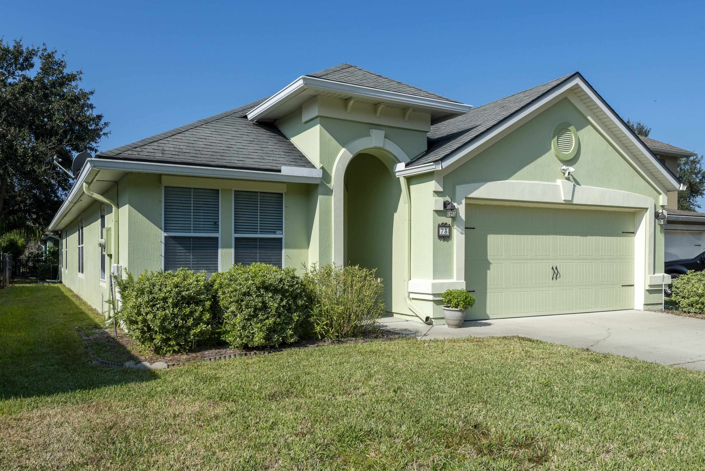 73 Durango Drive St. Augustine, FL 32086 - Photo 34 of 38 a front view of a house with a yard