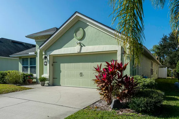 a view of a house with swimming pool and a yard