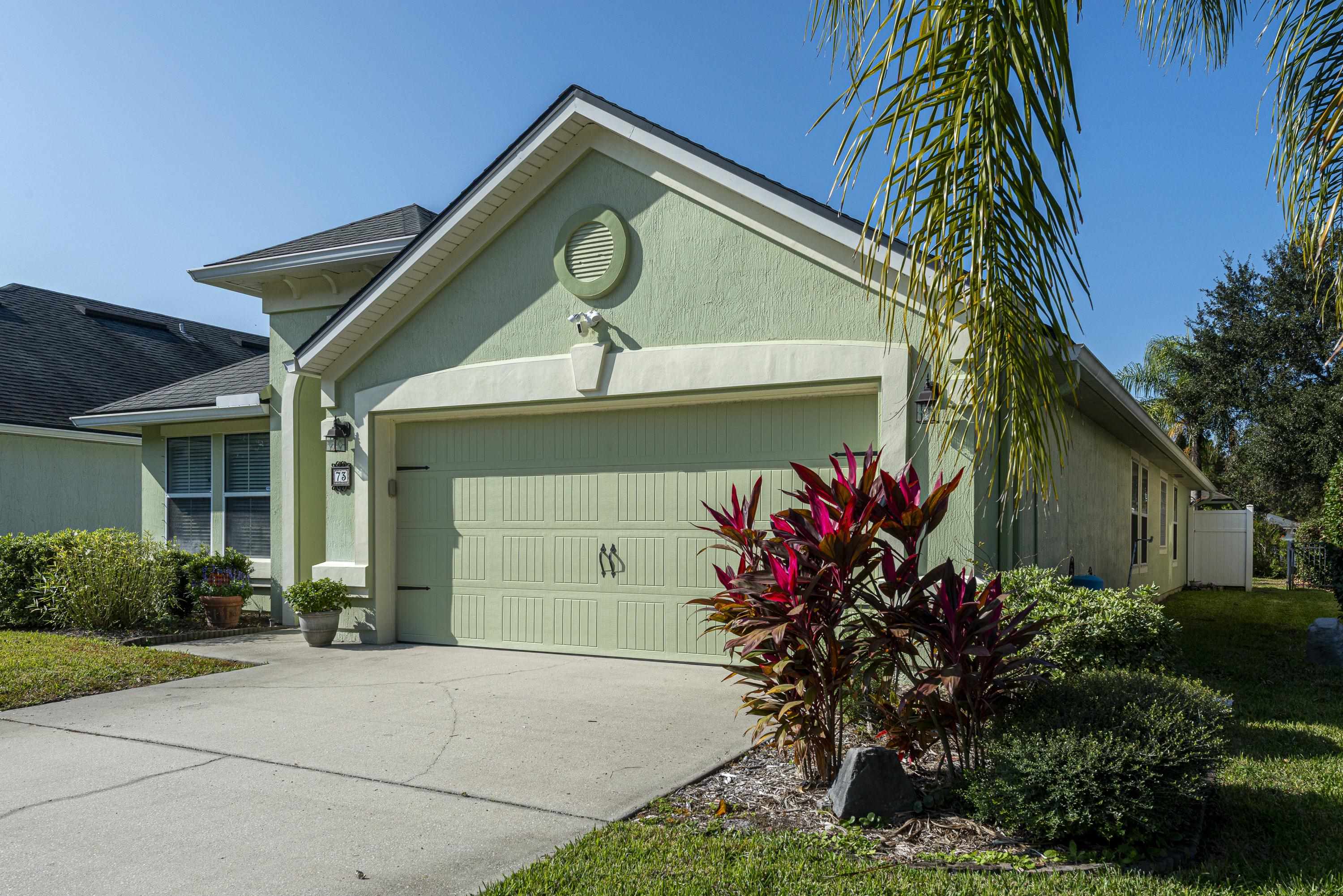 73 Durango Drive St. Augustine, FL 32086 - Photo 35 of 38 a front view of a house with lots of green space