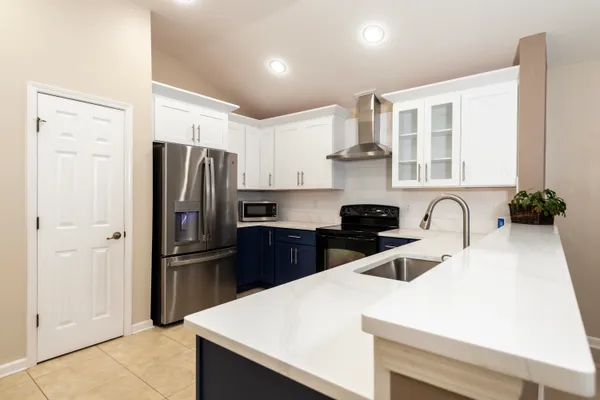 a view of a kitchen with a sink and cabinet area