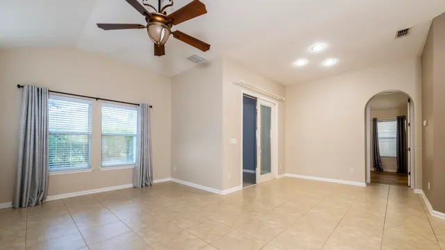 a kitchen with stainless steel appliances a refrigerator sink and white cabinets