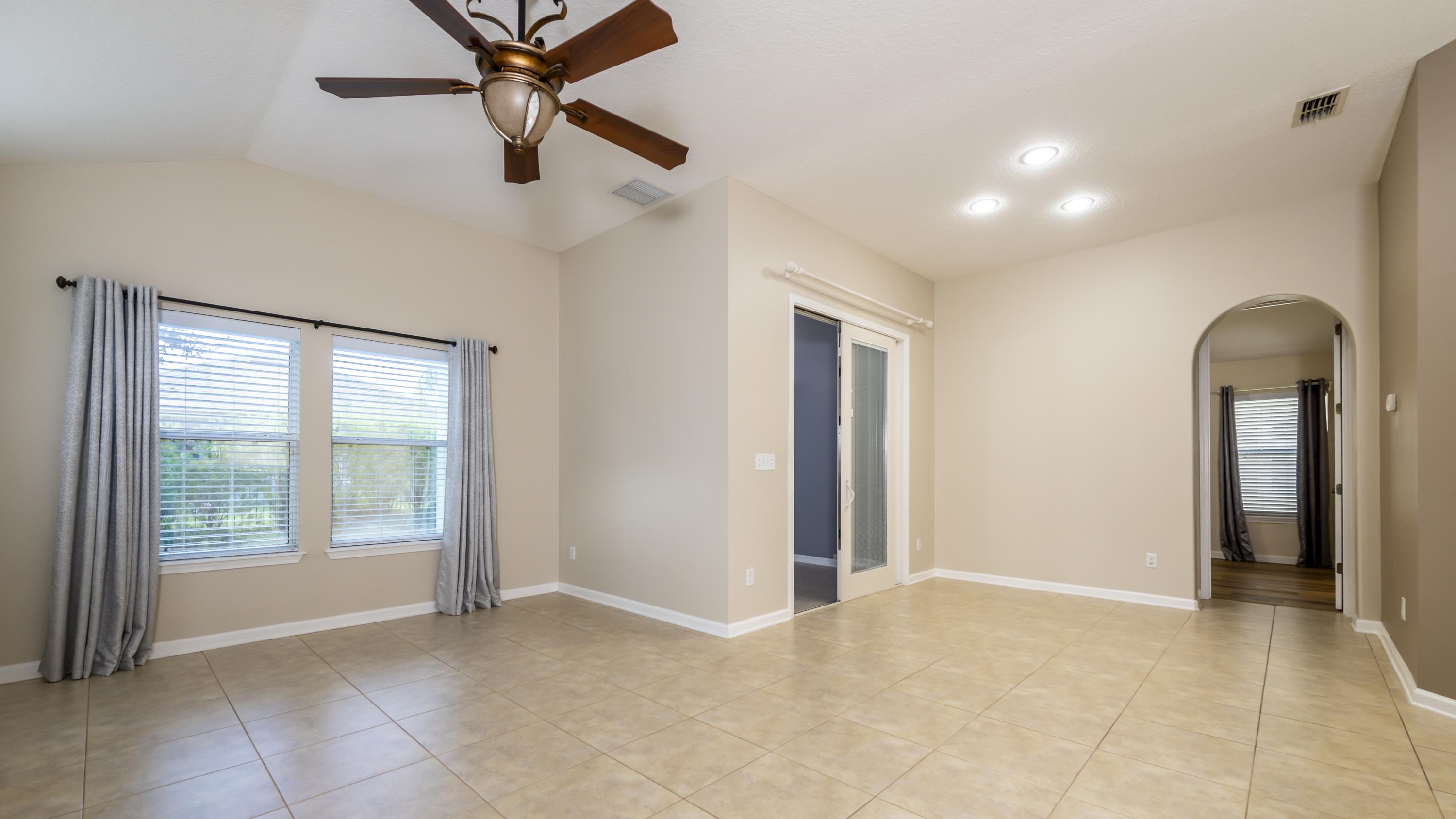 73 Durango Drive St. Augustine, FL 32086 - Photo 10 of 38 a view of a livingroom with a ceiling fan and window