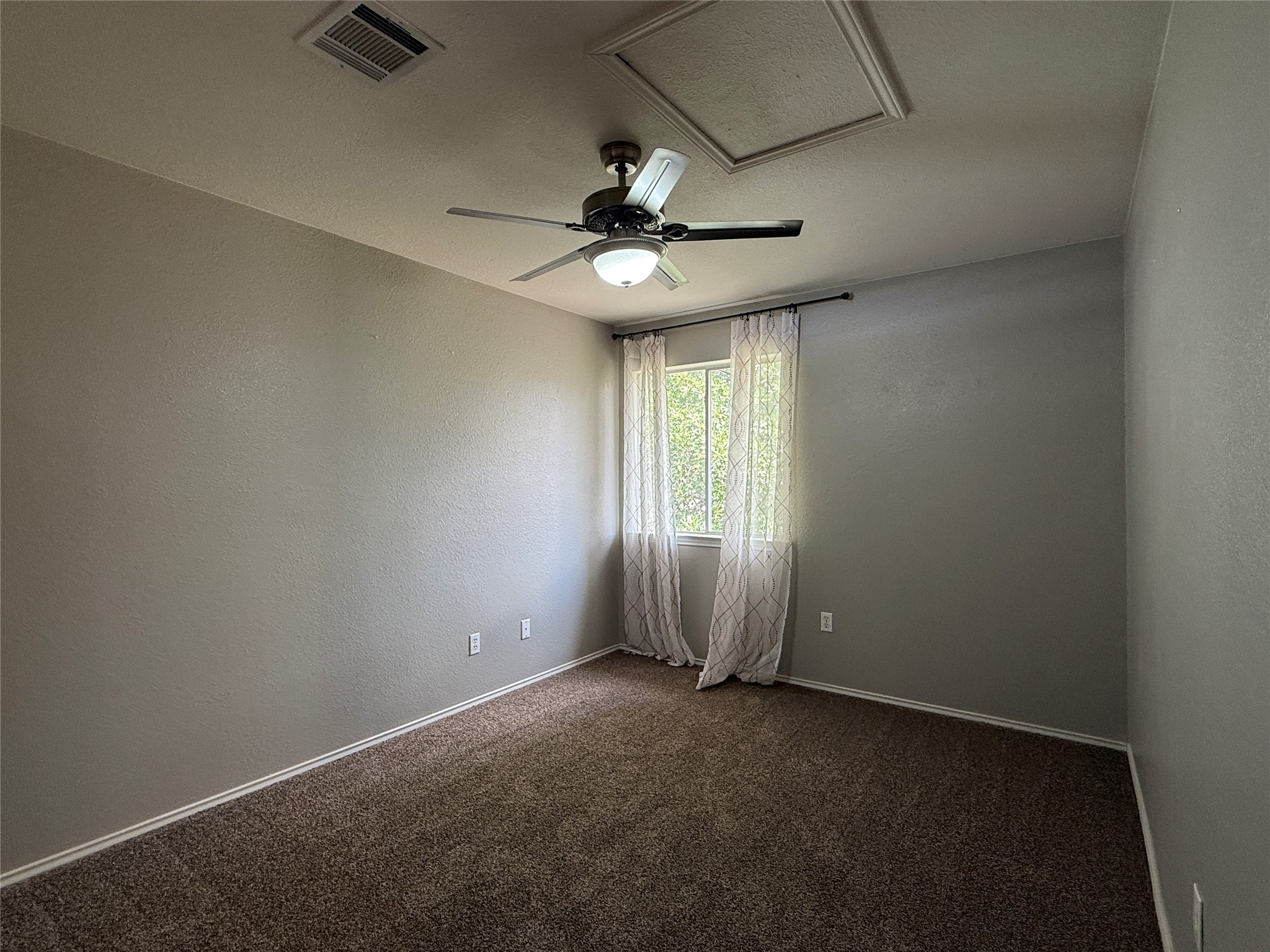 2120 Jester Farms Road Round Rock, TX 78664 - Photo 17 of 28 A well-lit bedroom with ample space for personalization.