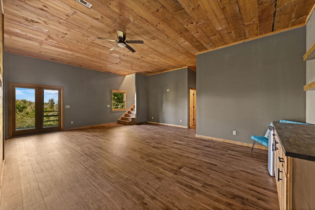 479 Big Timber Road Mineral Bluff, GA 30559 - Photo 34 of 60 a view of an empty room with window and wooden floor