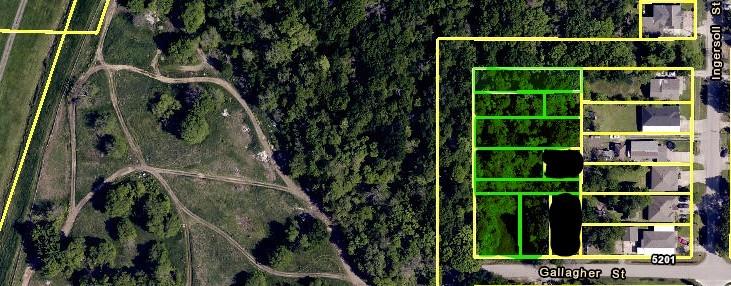 a view of a house with a tree in a backyard