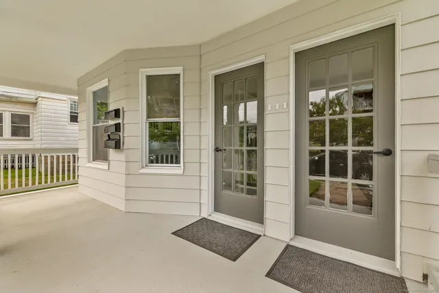 a view of front door and a window