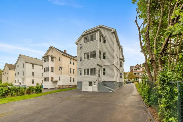 front view of a house with a street