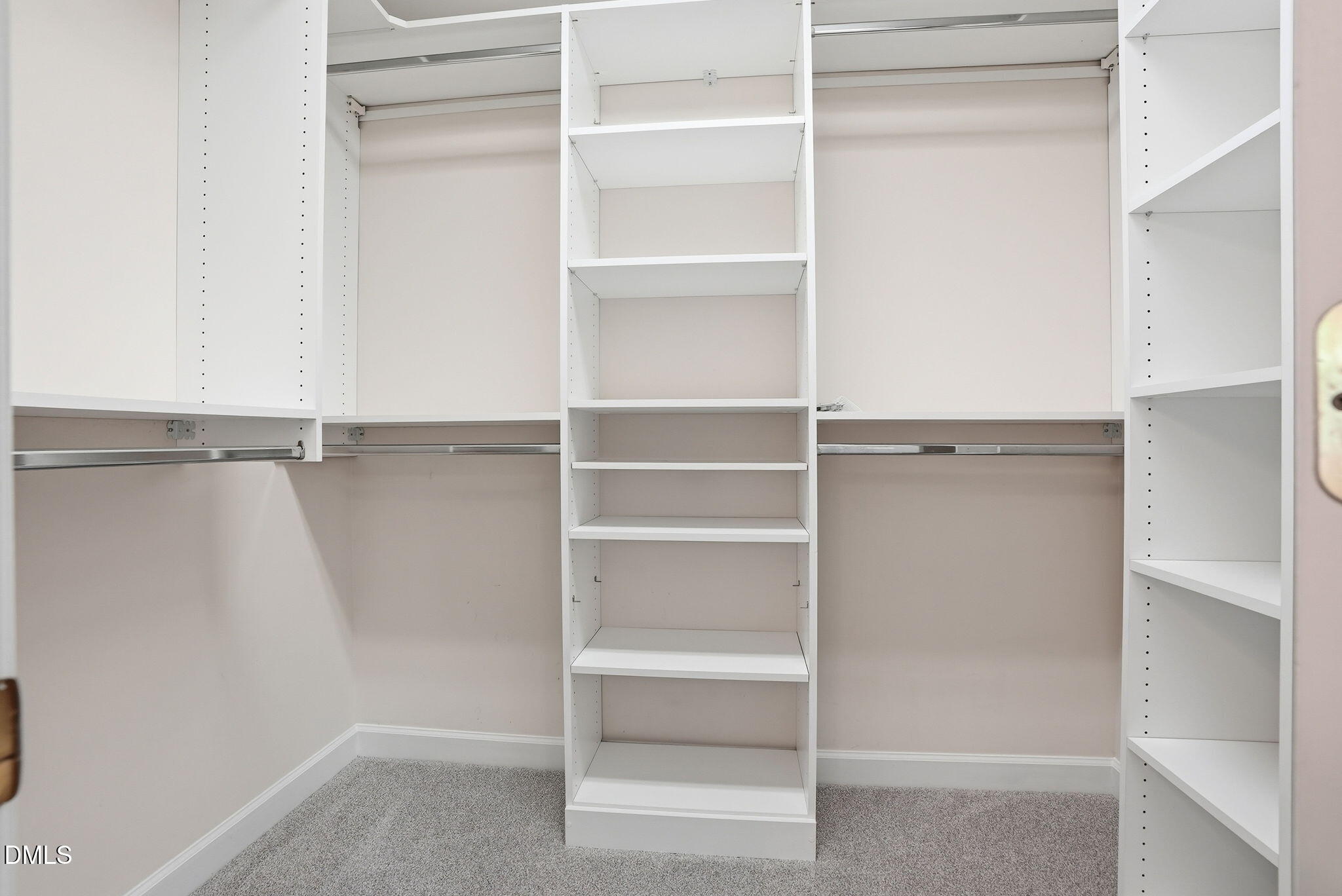 7 Morgans Ridge Lane Durham, NC 27707 - Photo 56 of 75 a view of walk in closet with empty racks
