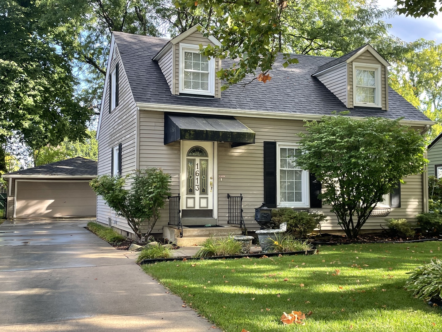 1613 Jones Street Joliet, IL 60435 - Photo 1 of 29 a view of a house with yard and plants