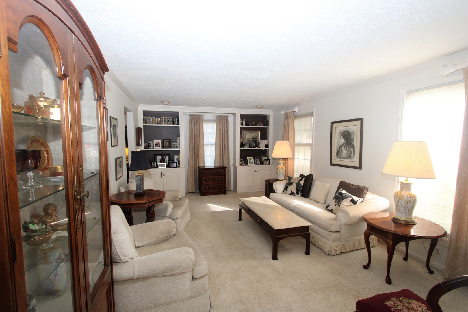 1613 Jones Street Joliet, IL 60435 - Photo 5 of 29 a living room with furniture and a lamp
