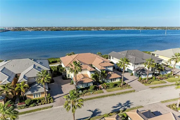 an aerial view of a house with a ocean view